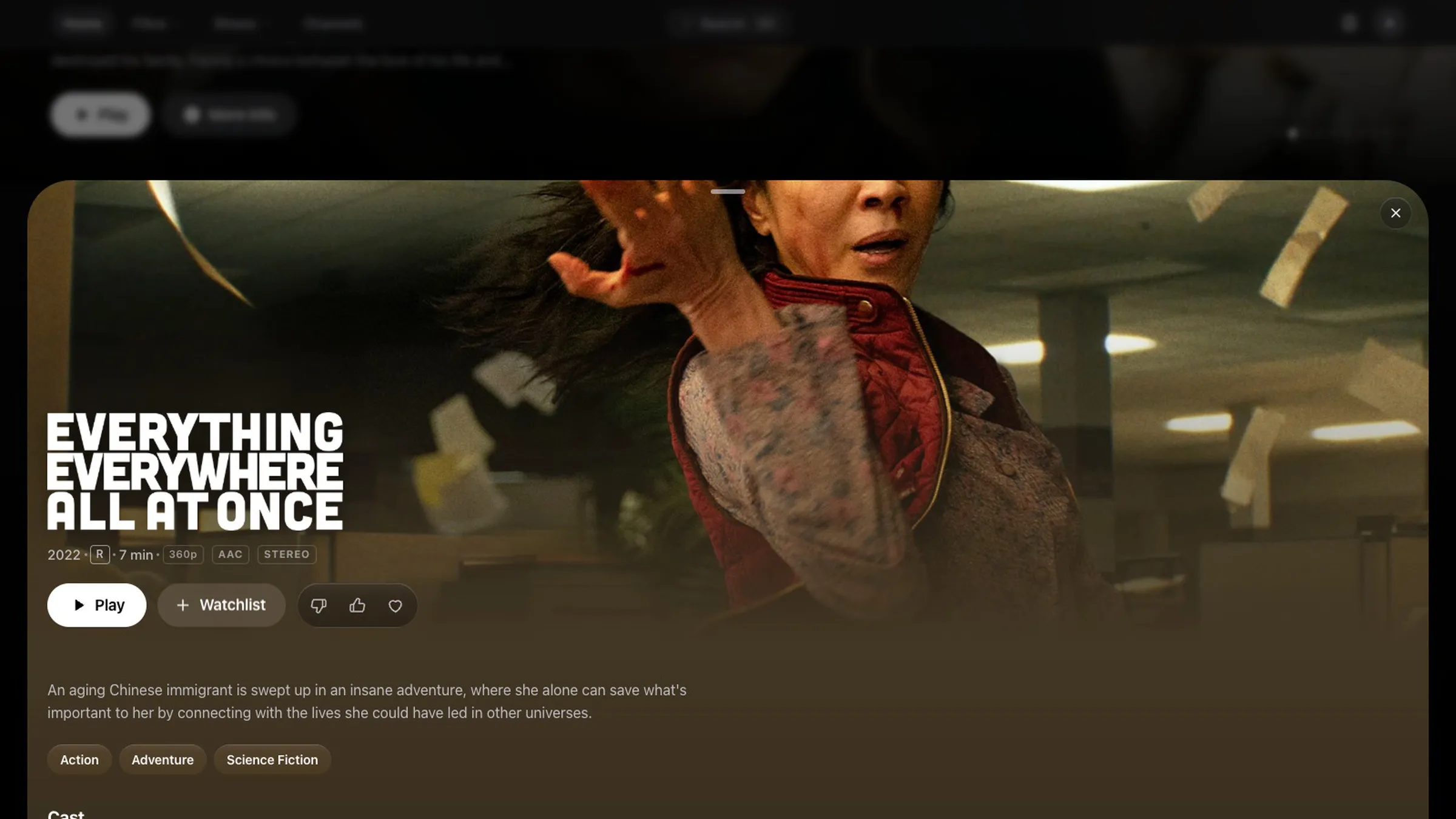 A film's details rising as a sheet over the home page: its title art, year, runtime and format, Play and Watchlist buttons, a synopsis and genres.